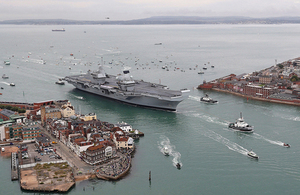 Pictured is Britain's future flagship HMS Queen Elizabeth as she sailed into her home port of Portsmouth for the first time.