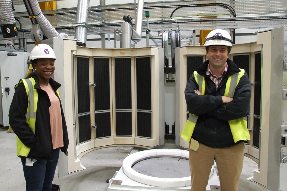 Rob Goodwill, Magnox Ltd Senior Project Manager, and Tomi Ashiru-Balogun, Magnox Ltd Senior Project Engineer in front  Advanced Vacuum Drying System (AVDS) at Dungeness A nuclear site