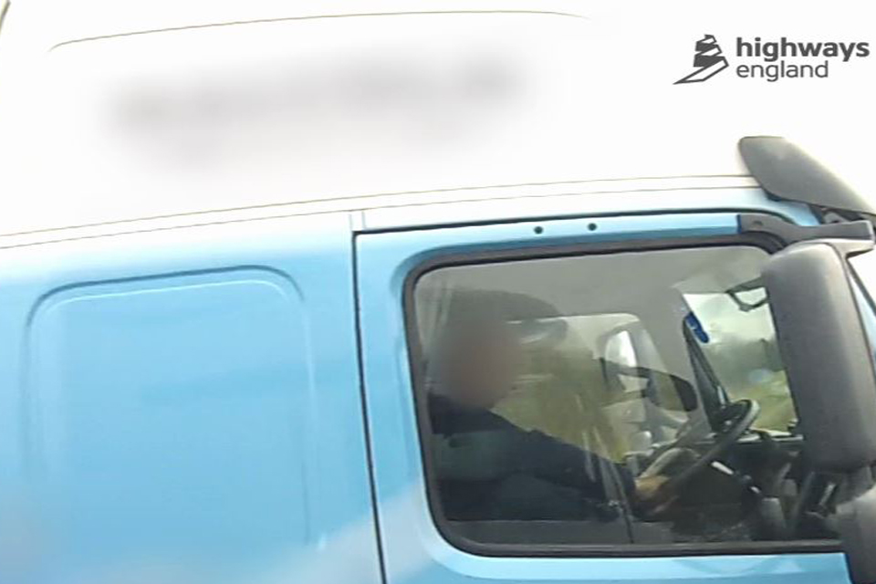 Image of driver with foot on the dashboard