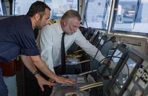 RAdm Tim Lowe and Lt Kyle Walkley on board HMS Gleaner