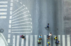 People moving across the road at a zebra crossing. Credit: ultramansk/Shutterstock.com