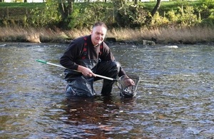 Image shows Paul Frear stocking fish into the Tees