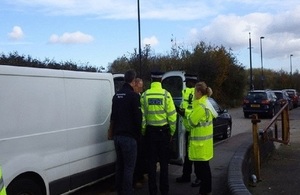 Environment officers checking waste carriers