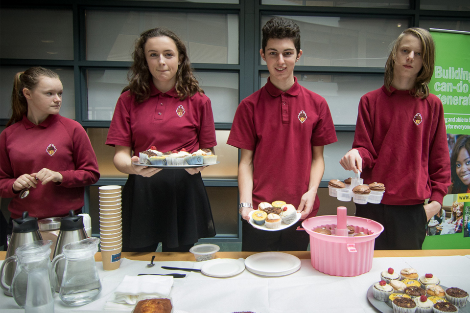 Image of students with cakes