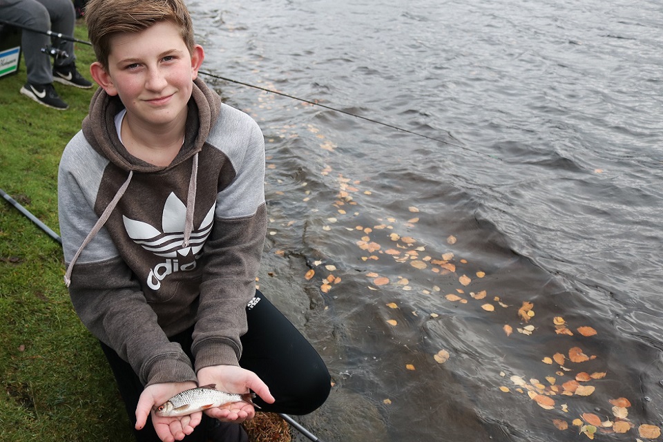 Image shows youngsters Jack Canham with the fish he caught. 