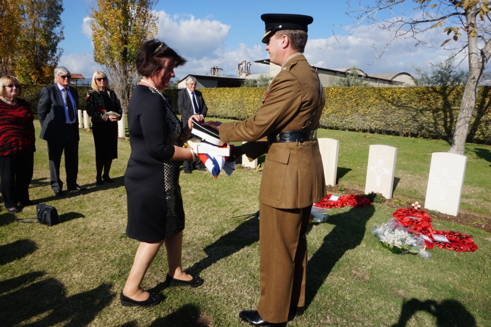 2nd cousin Susan Henry receives a presentation of a regimental cap and belt along with the Union Flag on behalf of the Goulden family, Crown Copyright, All rights reserved