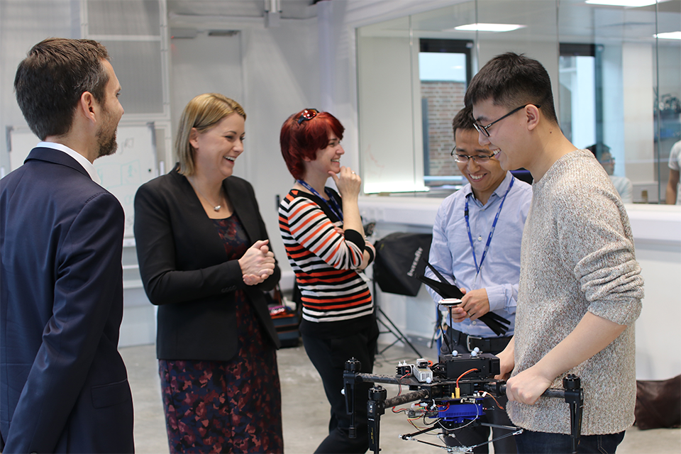 Baroness Sugg with PhD students