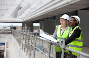 Workers on the London 2012 construction project inside the handball arena, which became the Copper Box