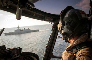 An 815 Naval Air Squadron Lynx helicopter approaches FS Surcouf [Picture: Crown copyright]