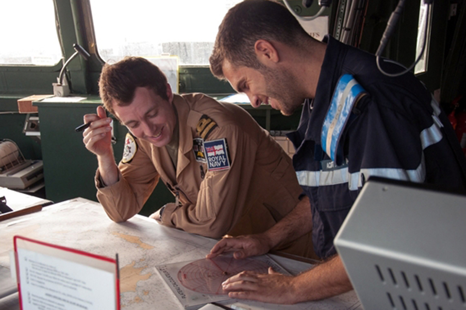 A member of 815 Naval Air Squadron and a French sailor on board FS Surcouf