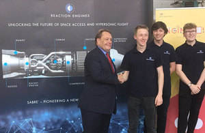 Picture of John Hayes MP with apprentices in front of the Reaction Engine display.