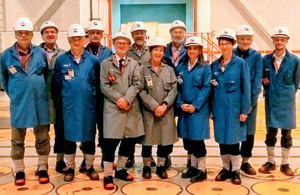 Committee members standing in Sellafield