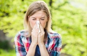 Woman sneezing with flu