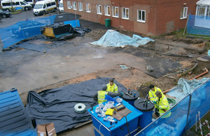 Aerial view of Environment Agency officers dealing with an diesel oil pollution at Christchurch hospital