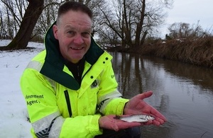 Image shows Paul Frear holding a fish