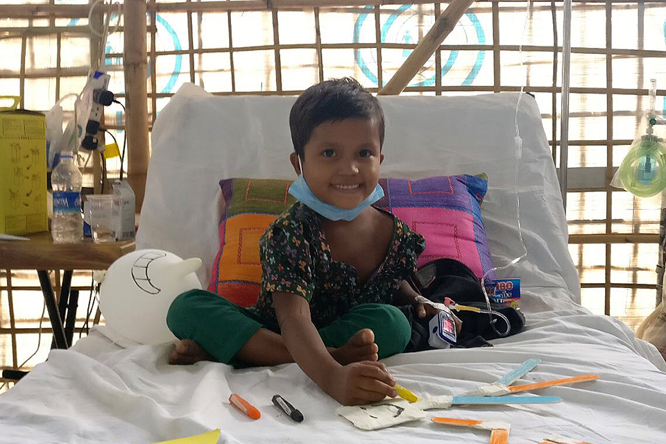 Six-year-old Sumaiya, sitting up in bed and already recovering after receiving diphtheria antitoxin treatment.