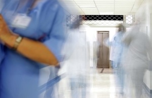 Doctors walking in a busy hospital corridor
