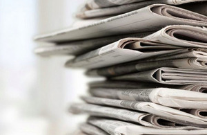 stack of folded newspapers