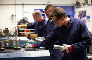 Engineers in a workshop by Monkey Business Images at Shutterstock