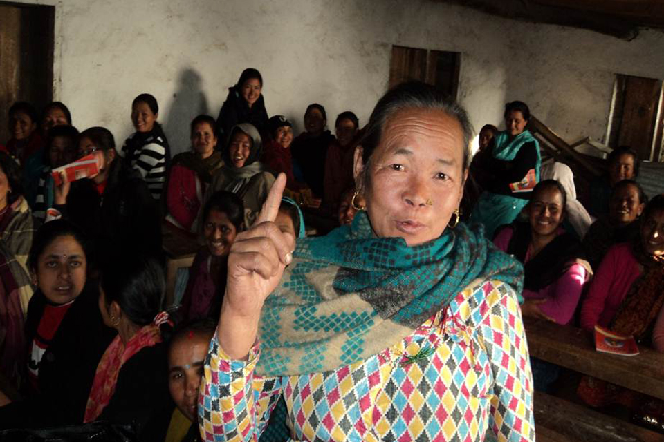 A women holds her hand up with one finger extended. Picture: UNICEF