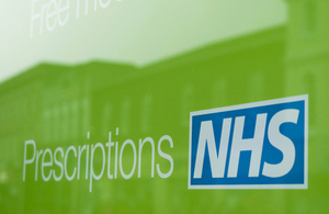 NHS prescriptions sign in pharmacy shop window