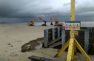 The outfall at Monktonmead - picture shows work being carried out at outfall pipe on a beach, with two mechanical diggers behind