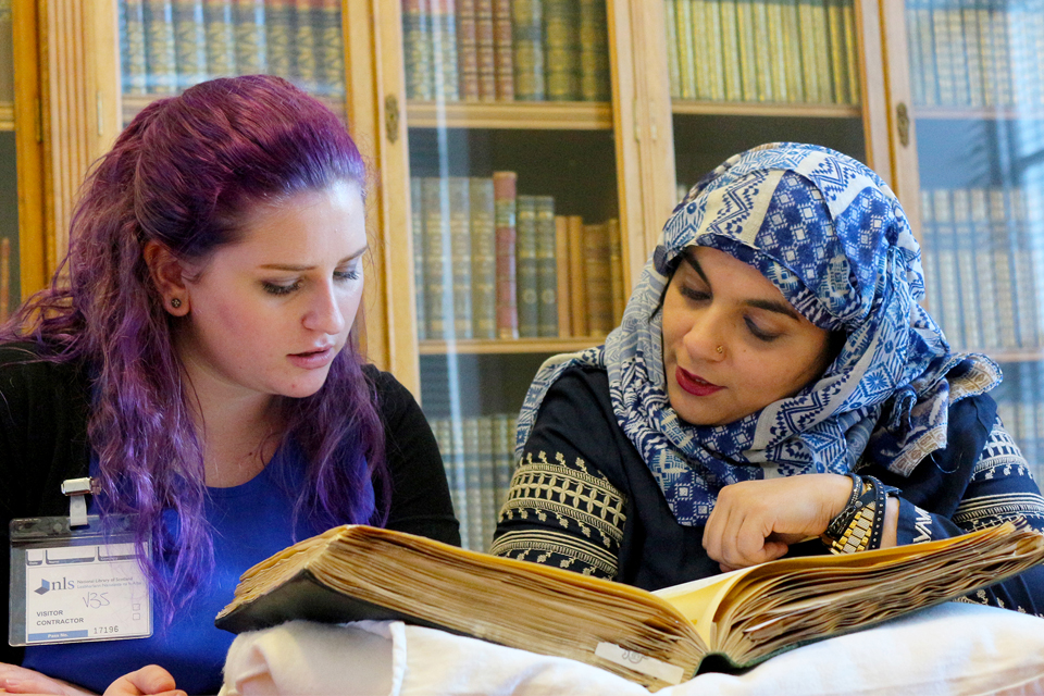 Scotswummin youth workers Fozzia and Rebecca research Scottish women’s history at the National Library of Scotland. Credit - © YouthLink Scotland