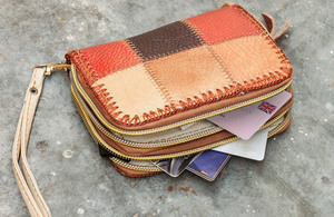 Purse with a driving licence tucked into slot