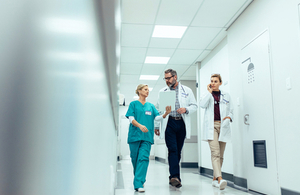 Medical professionals in a corridor. Via Jacob Lund at Shutterstock.com