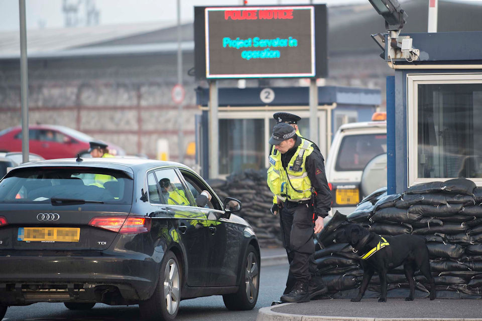 Police officers stopping a driver in a vehicle as part of Project Servator