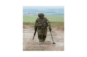 A soldier scanning the ground using Future Ground Search equipment.