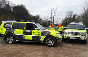 Traffic officers with Highways England vehicles