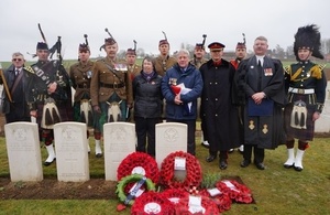 Ken and Kath MacDonald with the Reverend Paul van Sittert and members of the Royal Regiment of Scotland at the service. Crown Copyright, All rights reserved