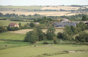 Fields with farm house in distance