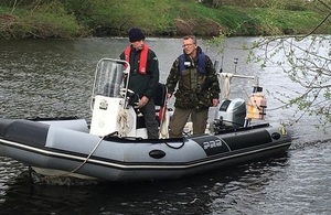 Image shows fisheries officers on the boat