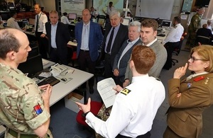 MSPs observing Exercise Joint Warrior listen to a briefing at HMNB Clyde.