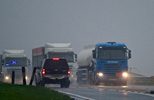 Lorries driving on a road.