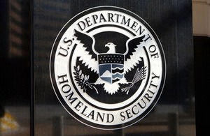 Department of Homeland Security seal at the US Immigration and Customs Enforcement Headquarters via Mark Van Scyoc at Shutterstock