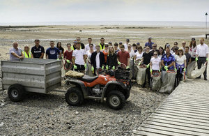 Volunteers picking up litter on Seascale beach.