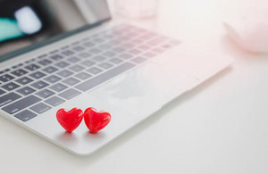 Two love heart symbols on a laptop keyboard