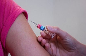 Someone receiving a HPV vaccine.