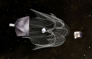 Satellite using a net to capture space junk.