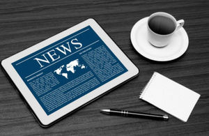 News tablet and coffee mug