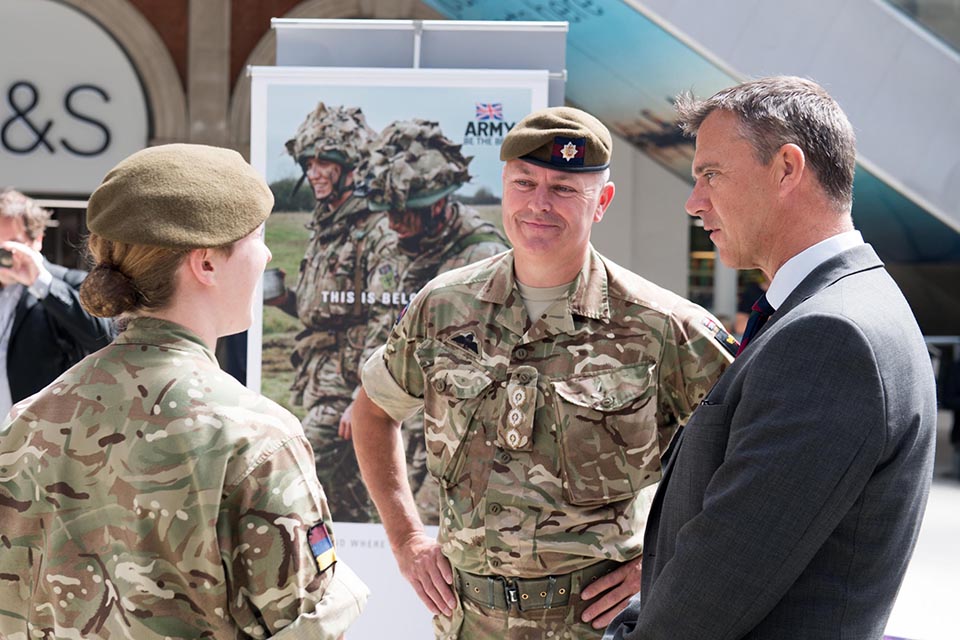 Minister for the Armed Forces Mark Lancaster speaks to reservists at Waterloo Station