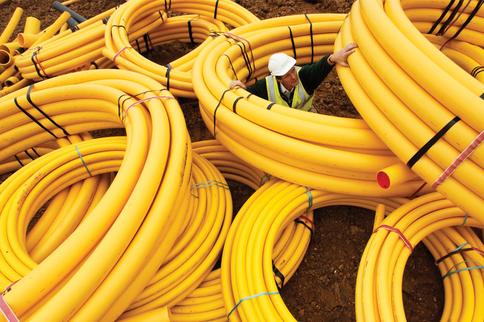 Worker inside giant cable coil