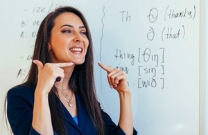 A teacher demonstrates how to pronounce sounds via Undrey at Shutterstock