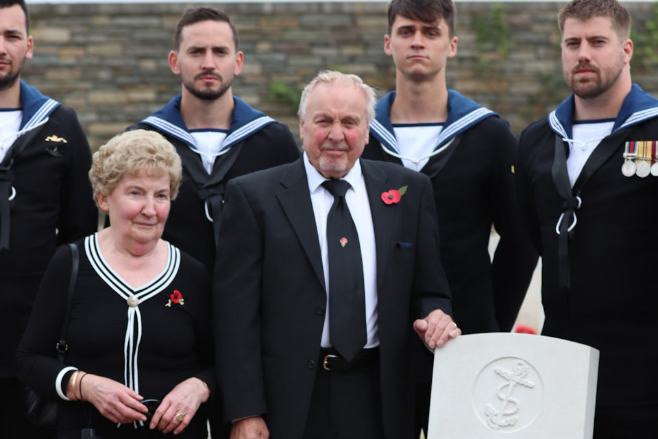 Nephew Frank Treasurer standing with his wife and members of the Royal Navy beside the grave of AB Robertson, Crown Copyright, All rights reserved