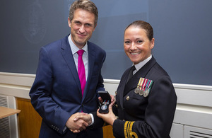 Lt Cdr Lindsey Waudby receives the Operational Service Medal Iraq and Syria from Defence Secretary Gavin Williamson