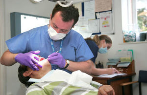 Dentist performing check-up on patient