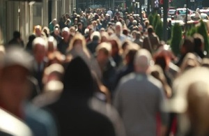 Blurred image of people walking in the street